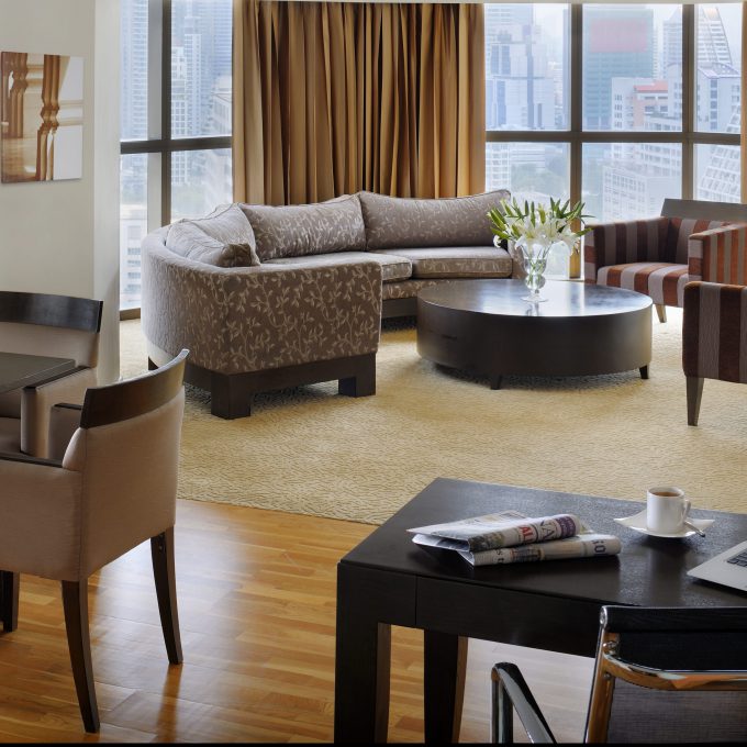 Living room brown couch dinning room and coffee table