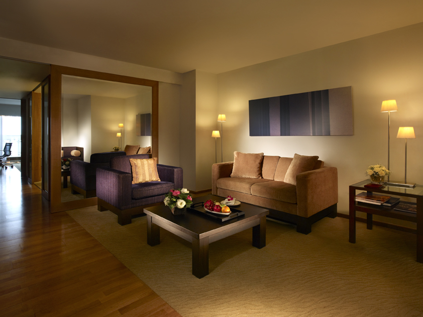 living room wall mirror brown furniture coffee table lamps