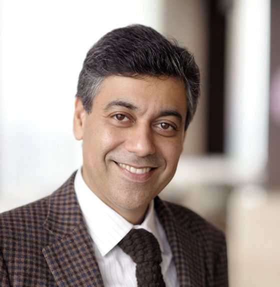 Head Shot man in brown suit smiling